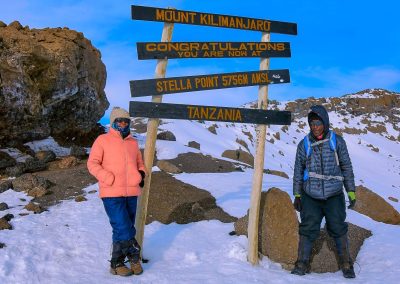 Angelina William and Joseph at Stella Point, Kilimanjaro—A trek with Rejoice Africa Tour